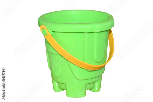 Baby green plastic bucket with yellow handle isolated on white background.