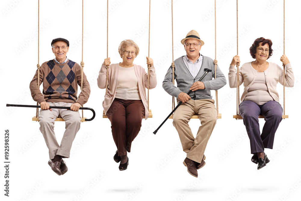 Cheerful seniors sitting on wooden swings and looking at the camera - obrazy, fototapety, plakaty 