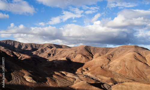 arid mountain scenery on Fuerteventura against beautiful sky