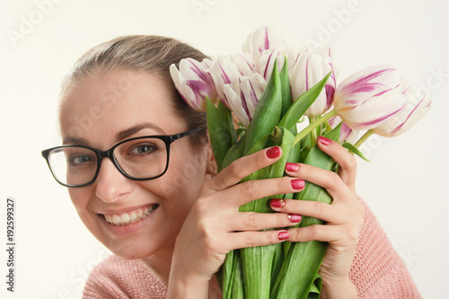 tender spring tulips in gentle female hands.