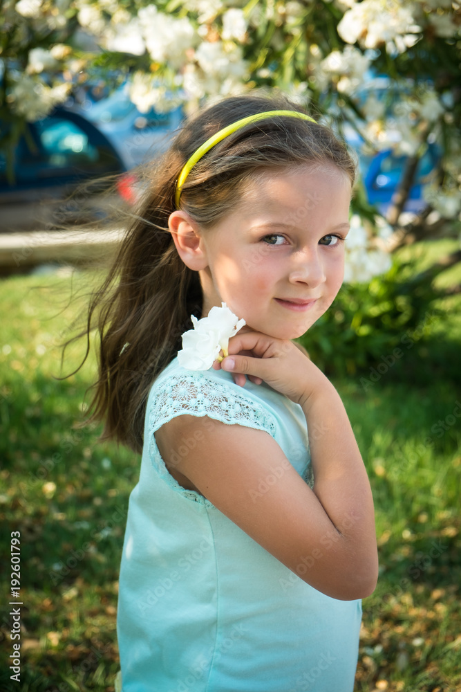 Portrait of a small girl in a summer park Portrait of a small girl in a summer park