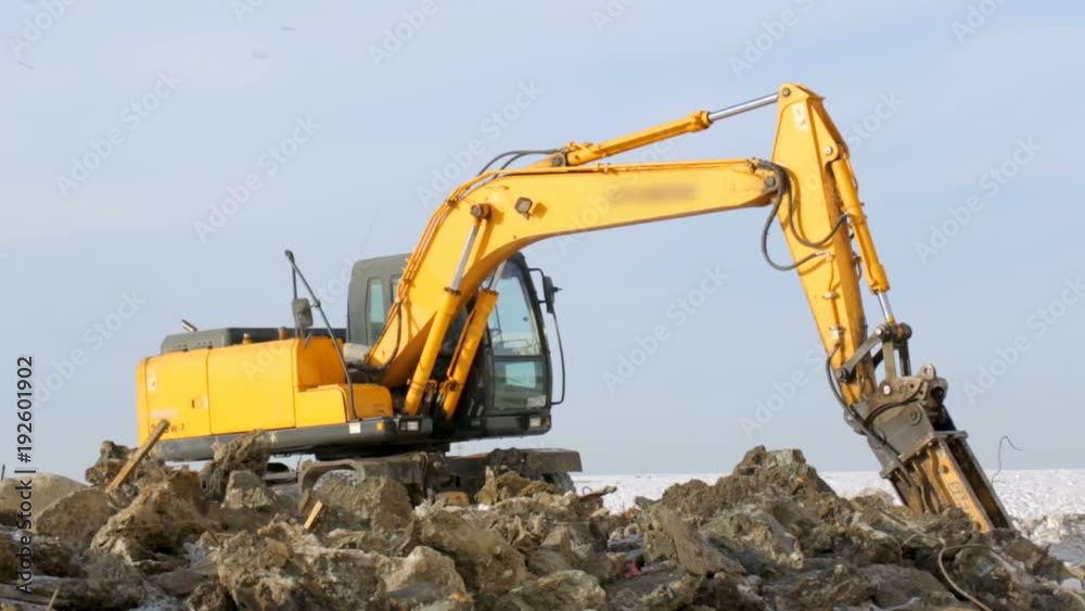 Hydrohammer machine working at building site Hydrohammer machine working at building site