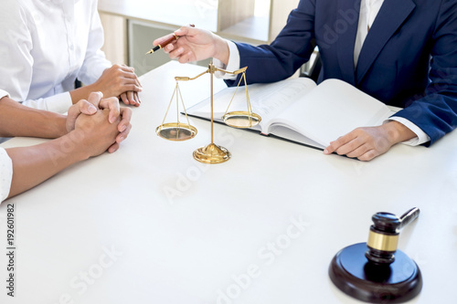 Teamwork of business lawyer colleagues, Having meeting with team at law firm, Consultation and conference between a female lawyer and customer tax and contract the company of real estate concept