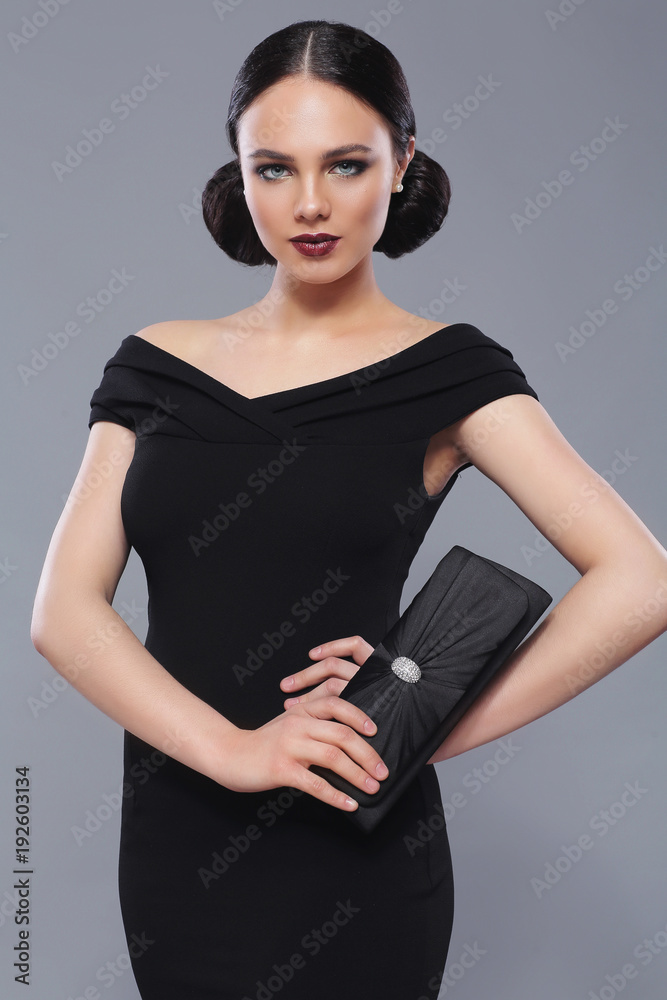 Young beautiful woman in black dress Young beautiful woman in black dress
