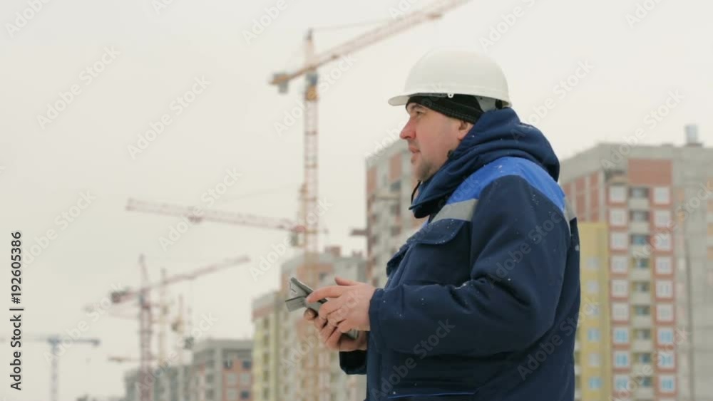 Foreman with pad at major construction project Foreman with pad at major construction project