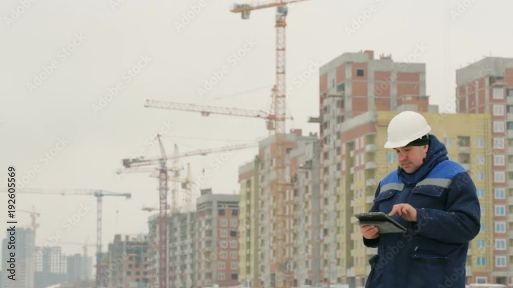 Foreman with pad at major construction project Foreman with pad at major construction project