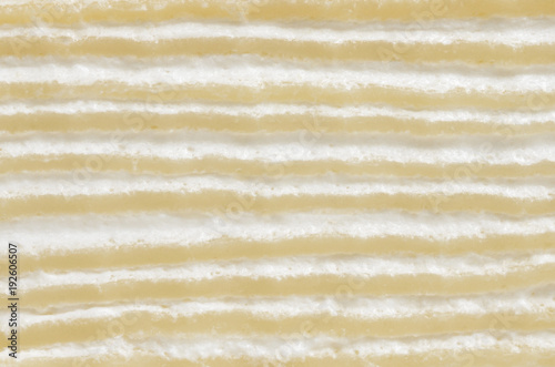 Crape cake, side view closeup image on sliced surface of crape cake present detail of crape cake layer texture and pattern that consist of crape layer alternate with cream layer, pattern background