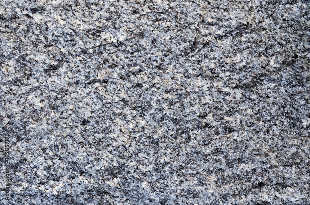 Nature texture of granite-gneiss rock a gneiss metamorphic rock that transformation from granite igneous rock and still has a granite texture, can use for a background Nature texture of granite-gneiss rock a gneiss metamorphic rock that transformation from granite igneous rock and still has a granite texture, can use for a background