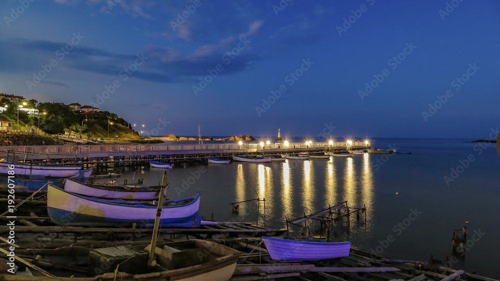 Ahtopol Bulgaria lighthouse and a pier at night