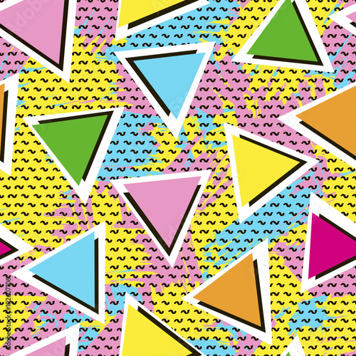 Colorful seamless pattern from triangles on the bright brush strokes background and black dots. 80's - 90's years design style. Trendy.