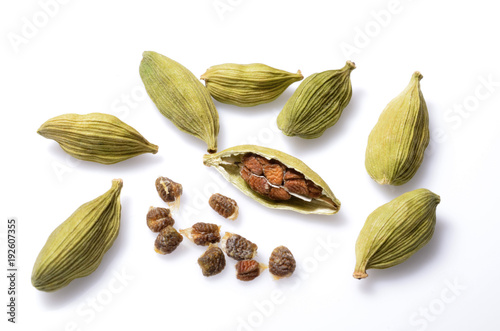 Cardamom pods and cardamom seeds isolate on white background