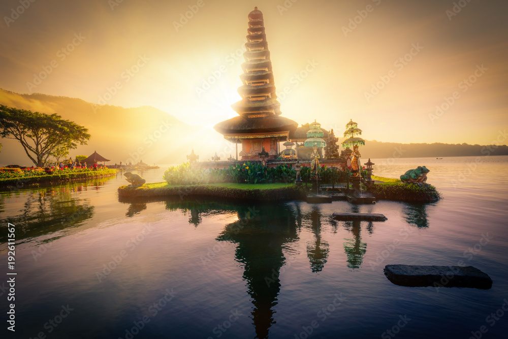 Pura Ulun Danu Bratan, Hindu temple on Bratan lake landscape with lens flare at sunrise in Bali, Indonesia. Pura Ulun Danu Bratan, Hindu temple on Bratan lake landscape with lens flare at sunrise in Bali, Indonesia.