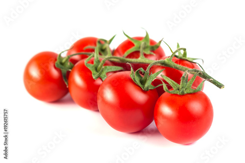 Bunch of red tasty fresh tomatos on the white background