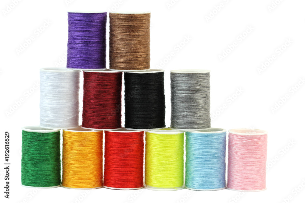 Colorful thread spools isolated on white background. Colorful thread spools isolated on white background.