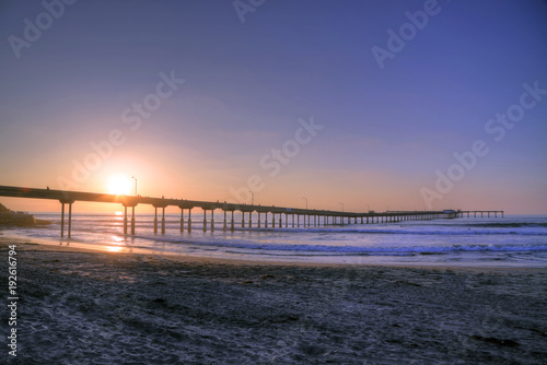 The sunset over the Ocean Beach Pier near San Diego  California.