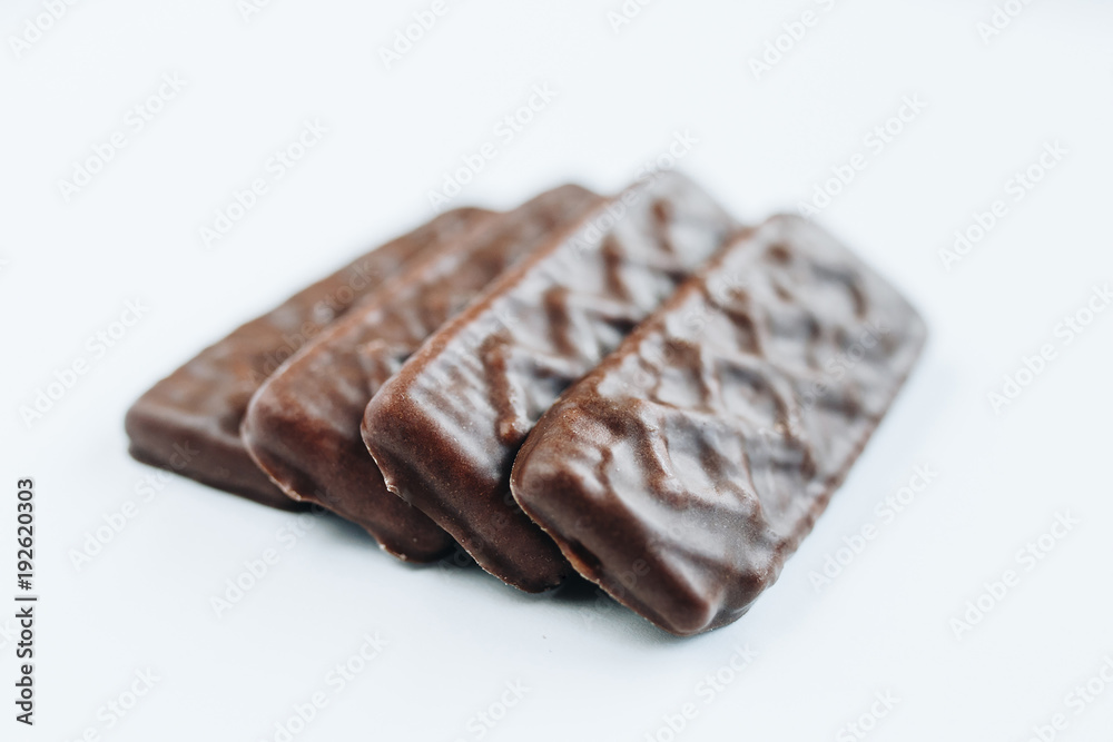 Close up of chocolate biscuits on white background Close up of chocolate biscuits on white background