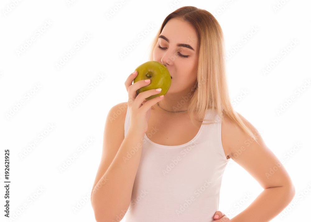 Pretty young girl with green apple, studio Pretty young girl with green apple, studio