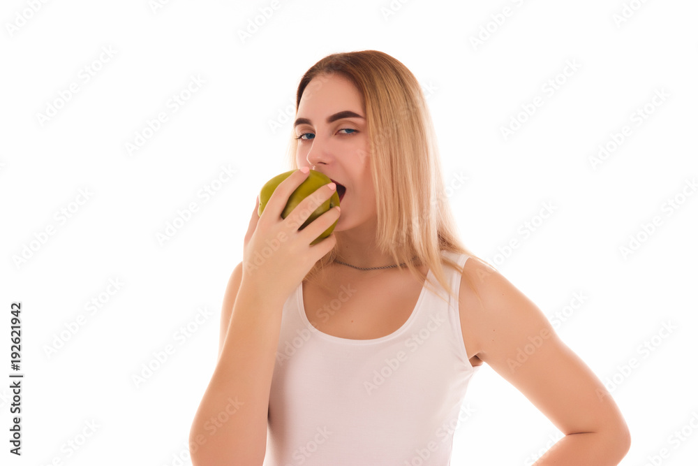 Pretty young girl with green apple, studio Pretty young girl with green apple, studio