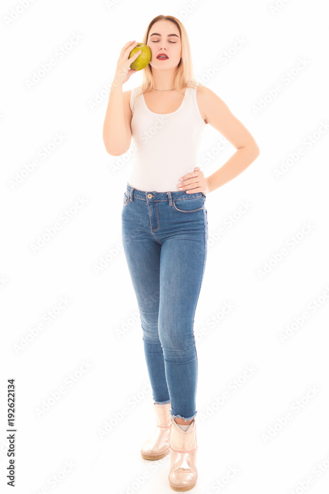Pretty young girl with green apple, studio Pretty young girl with green apple, studio