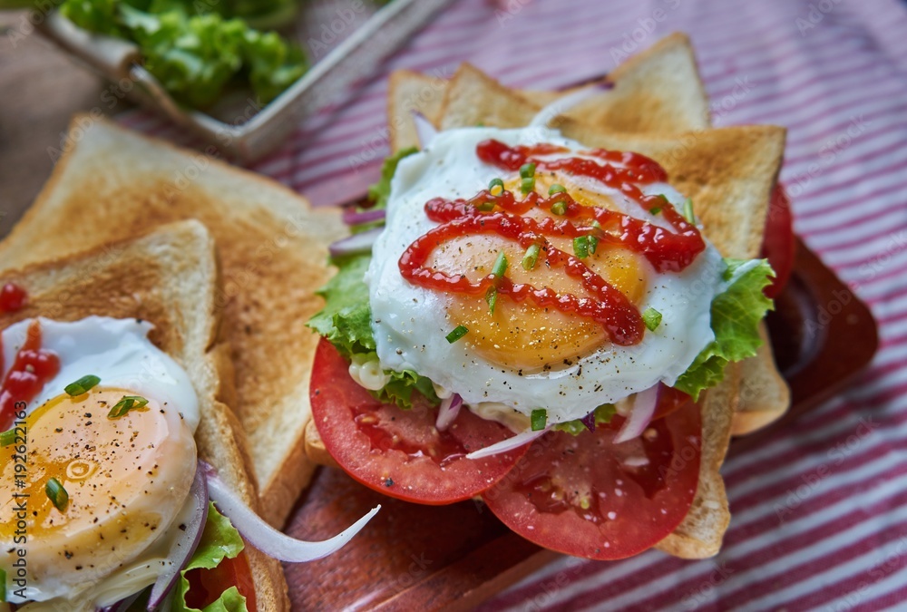 open-faced sandwich fried egg and vegetable