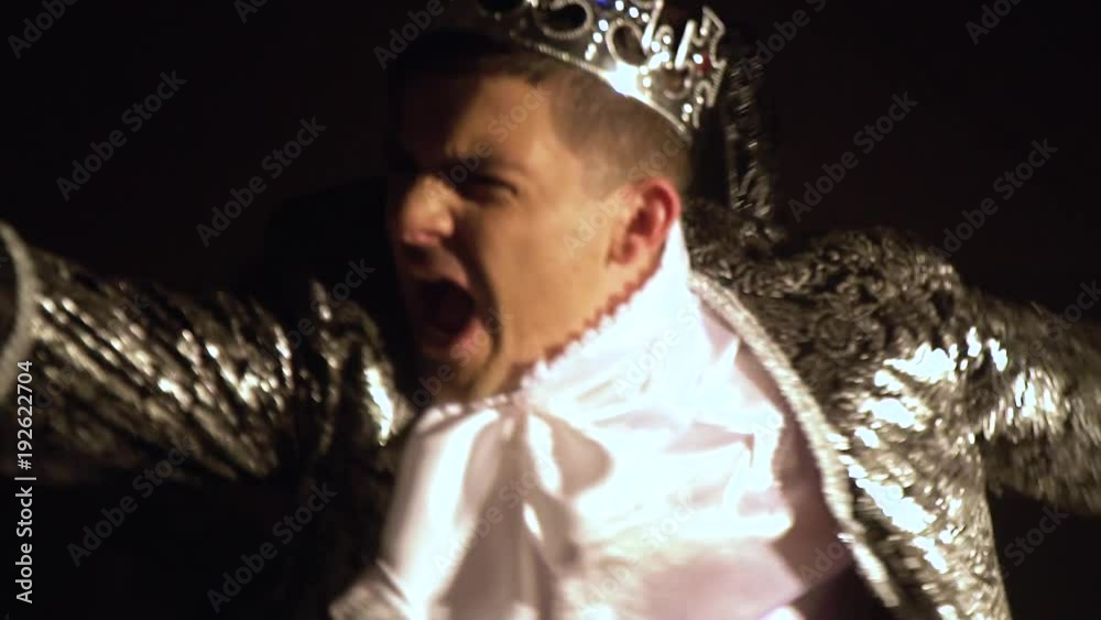 The man in the King's outfit makes a lunging forward. Live chess competition. The man in the King's outfit makes a lunging forward. Live chess competition.