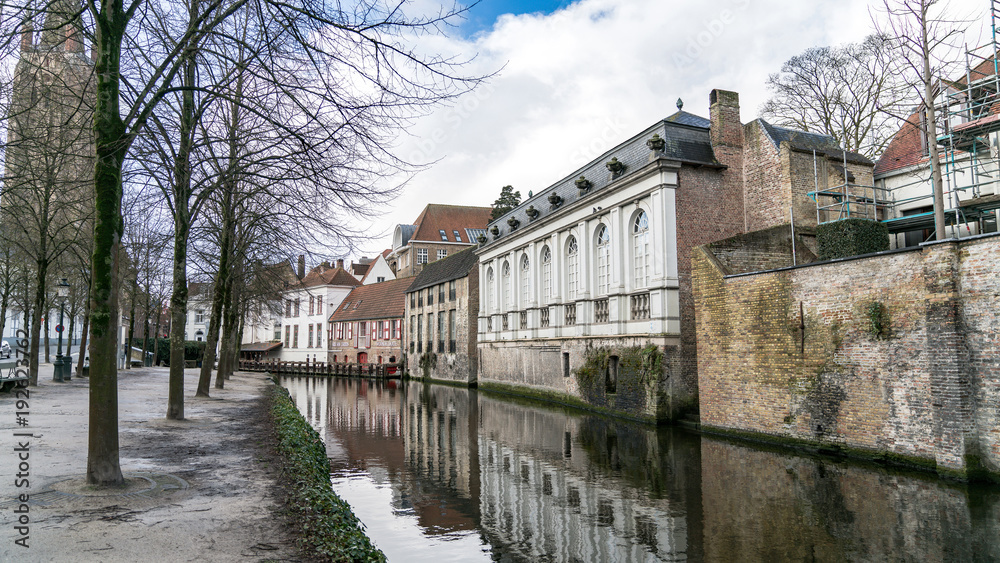 Scenery of water canal in Bruges in winter, cityscape of Flanders, Belgium.