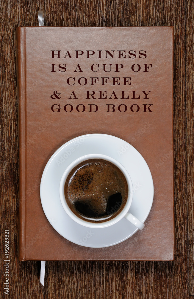 A book with a motivational quote and a cup of coffee A book with a motivational quote and a cup of coffee