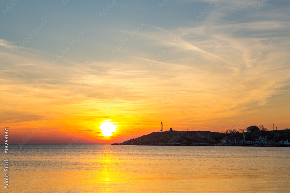 sunset over the sea.Sunset / sunrise with clouds, light rays and other atmospheric effect. sunset over the sea, calm . the concept of tranquility. rest and travel