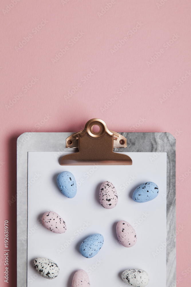 Easter eggs on a clipboard background Easter eggs on a clipboard background