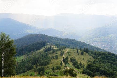 Fototapeta Naklejka Na Ścianę i Meble -  Landscape high road leading to the mountains in perspective