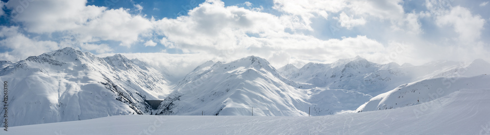 Panoramic view on beautiful snowy Alps near Oberalppass