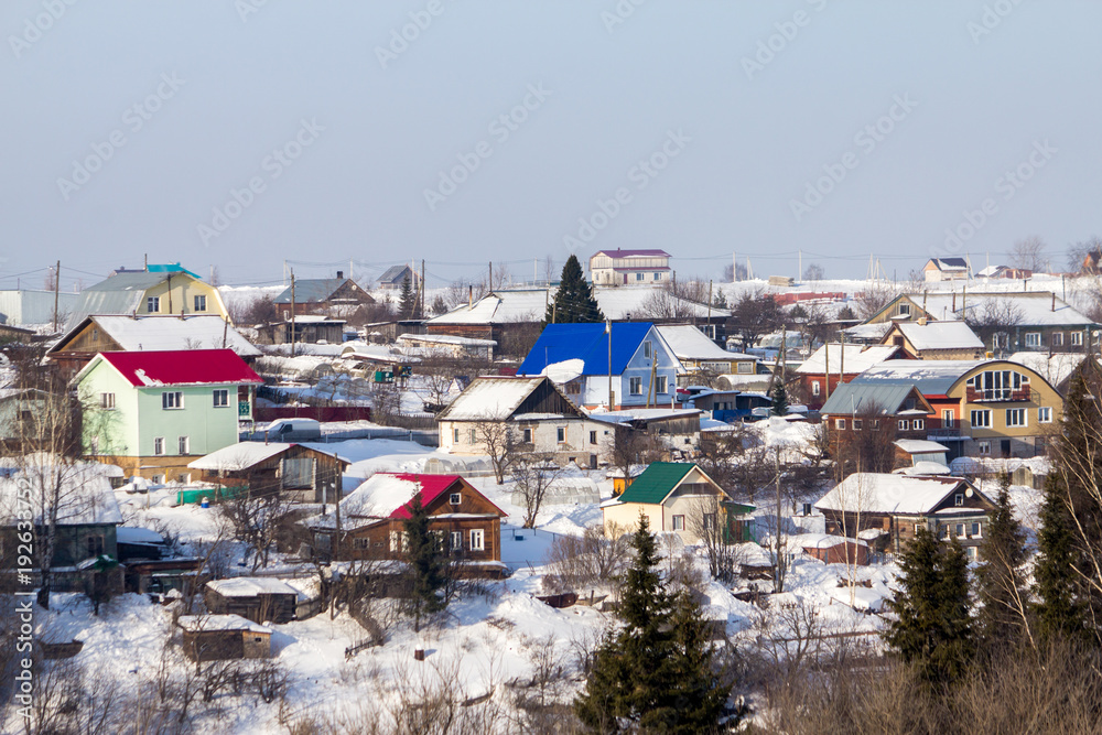 Obraz premium beautiful country houses on a winter sunny day