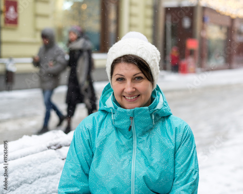 Portrait of a woman on Moscow street in winter in Russia.