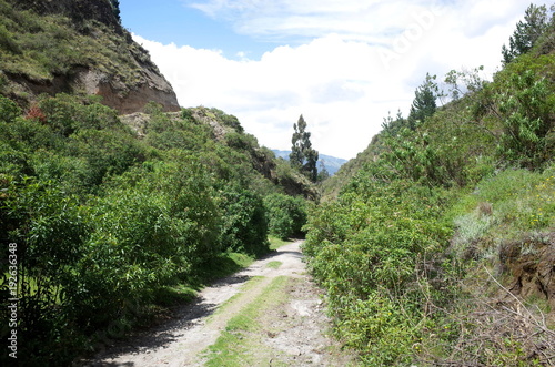 A mountain track winds through the Ecuadorian Andes on the Quilotoa Loop hike