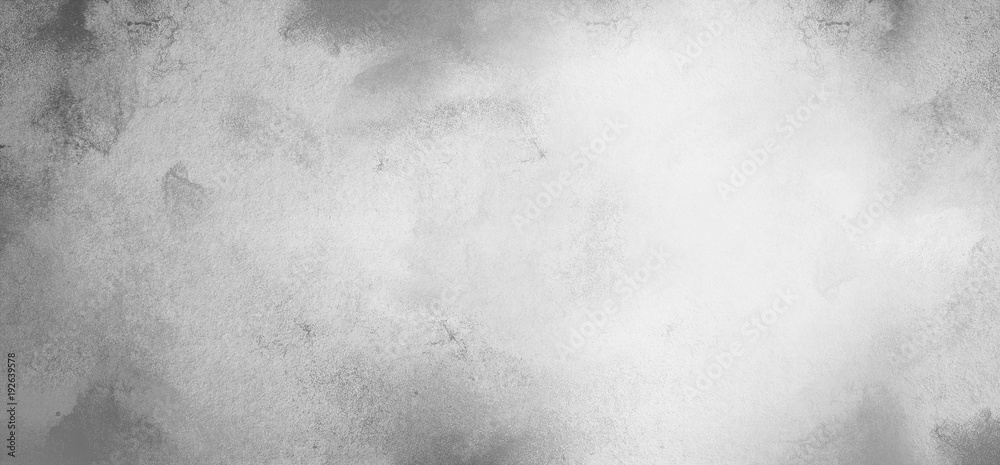 Gray abstract monochrome textured background with spots of paint. The effect of plastering an old wall or paper with ink.