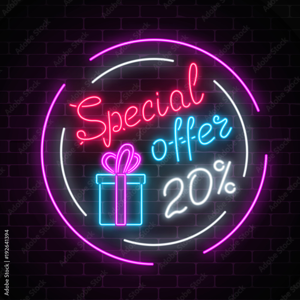 Glowing neon banner of big sale sign on dark brick wall background. Special offer symbol.