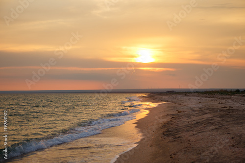 Seascape background with clouds and waves on sunrise. Beautiful sunset over the sea, scenic seascape by perfect timing when sunset over sea horizon is beautiful pattern for background