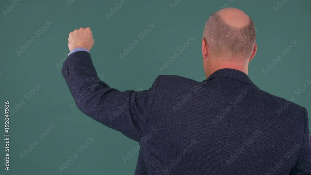 bald businessman protesting with fist up bald businessman protesting with fist up