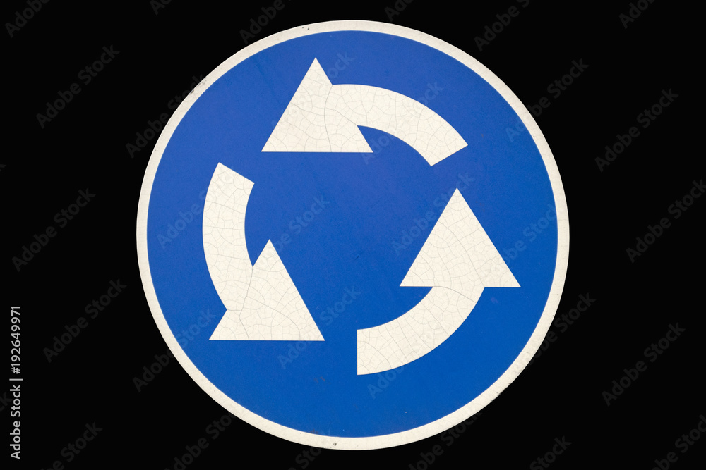 Old round road sign 'Roundable' isolated on black Old round road sign 'Roundable' isolated on black