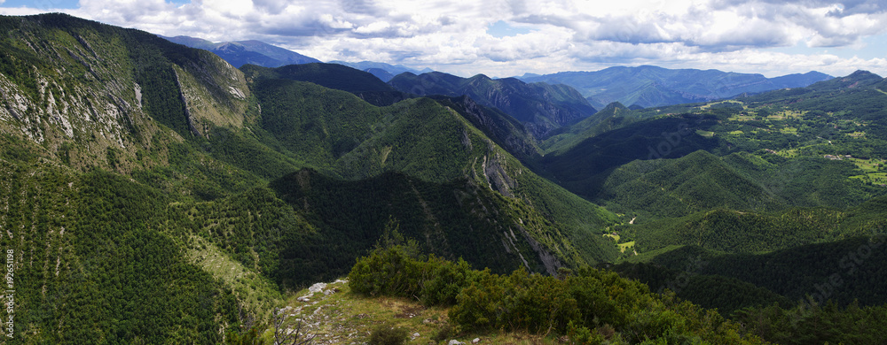 Fototapeta premium Green and rocky landscape from Mirador de Gresolet. Pyrenees, Catalonia, Spain