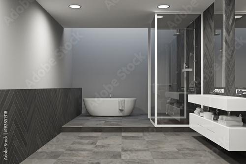 Interior of a gray bathroom with tiled floor