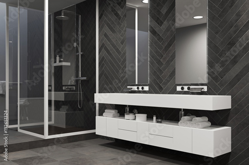 White sink vanity unit in a black bathroom  shower