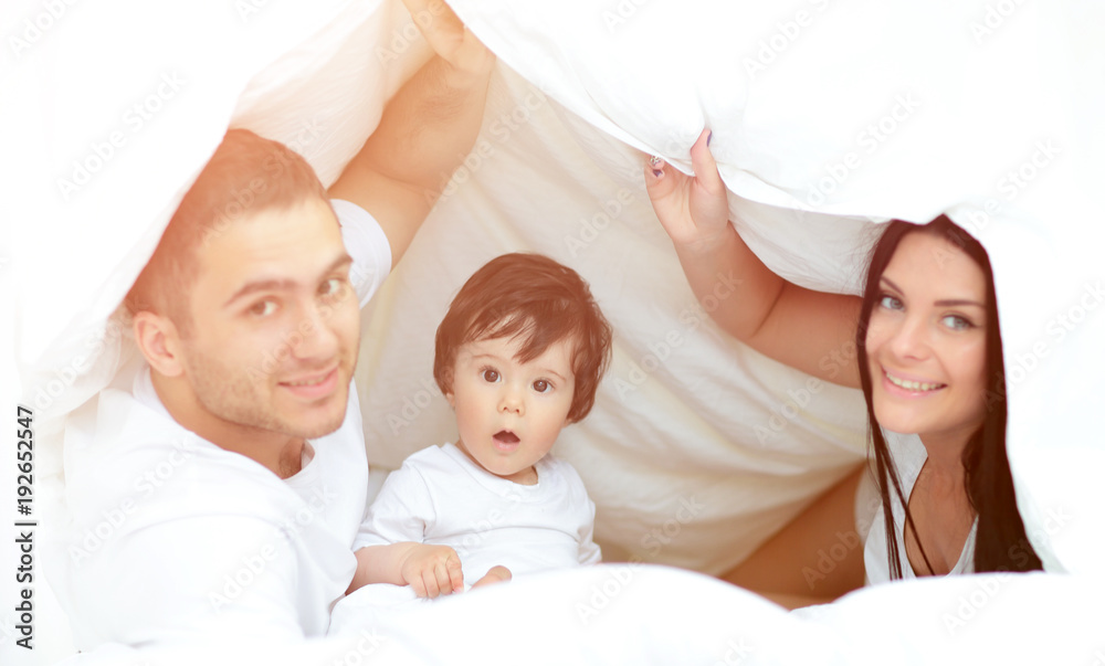 Happy young family with one child having fun together Happy young family with one child having fun together