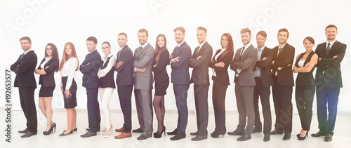 large business team standing arms crossed in front