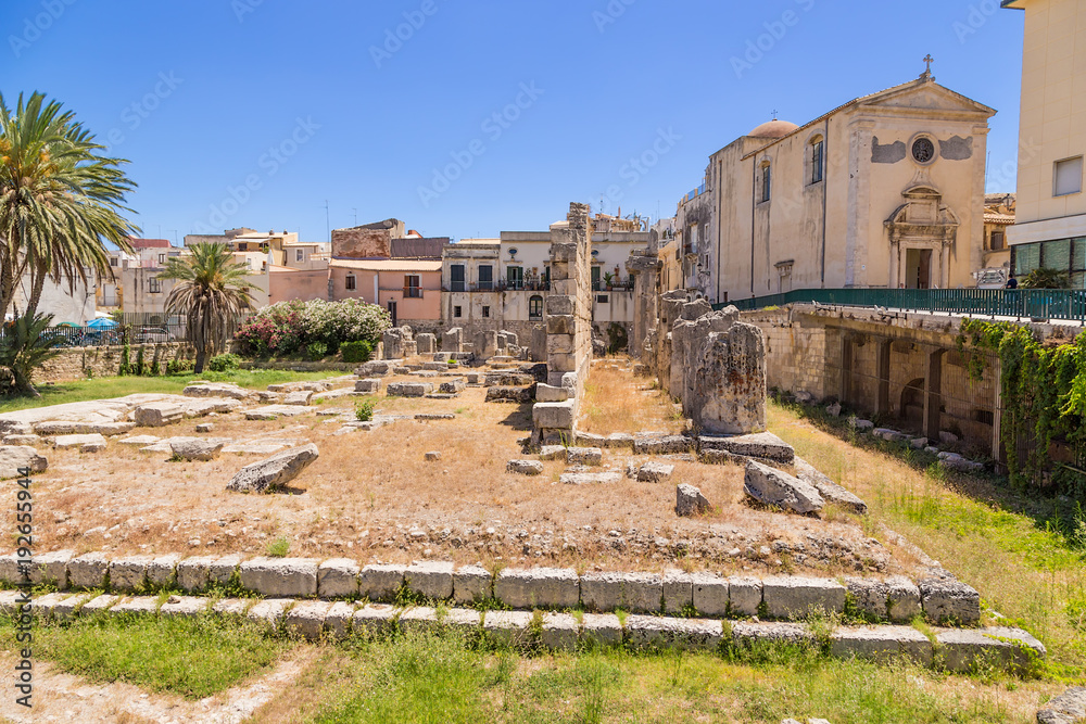 Syracuse, Sicily, Italy. Ruins of the Temple of Apollo, VI century BC. On the right is the church of San Paolo, the 17th century