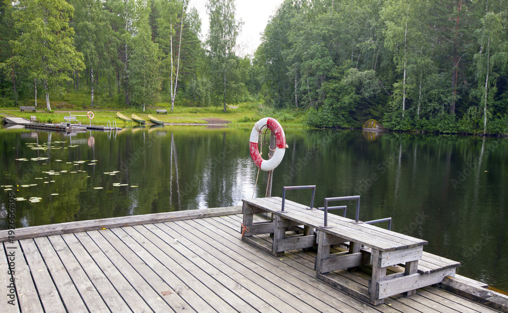 The mooring on the forest lake. Finland The mooring on the forest lake. Finland