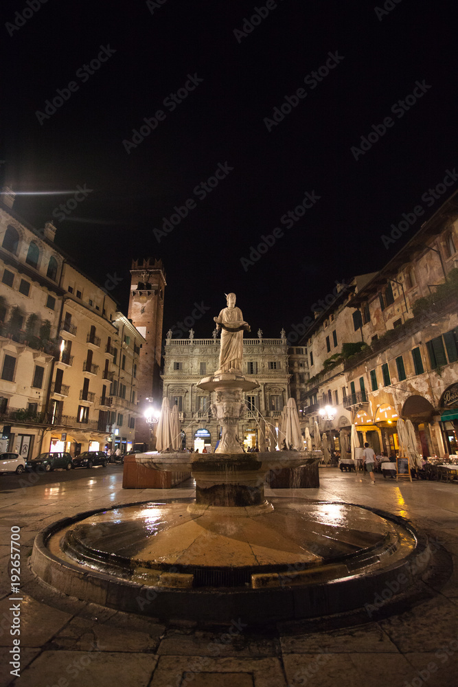 Fototapeta premium Verona, Italy July 17, 2013. Statue of the Madonna on Piazza delle Erbe at Night, Verona, Veneto, Italy