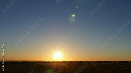Colorful sunrise timelapse over an open landscape. Versatile background or backdrop. 4K UHD.