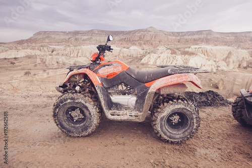 ATV Quad Bike in front of mountains landscape