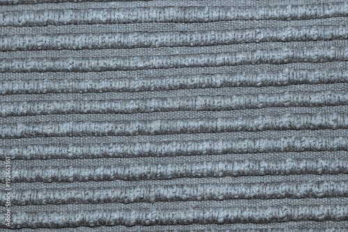 Texture by discoloured gray woven fabric, with lights.